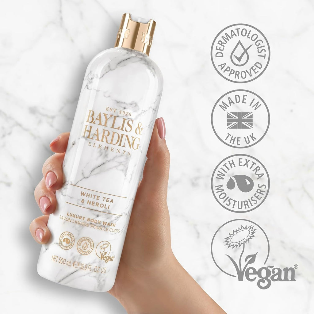Luxury body wash bottle with gold cap, held in hand