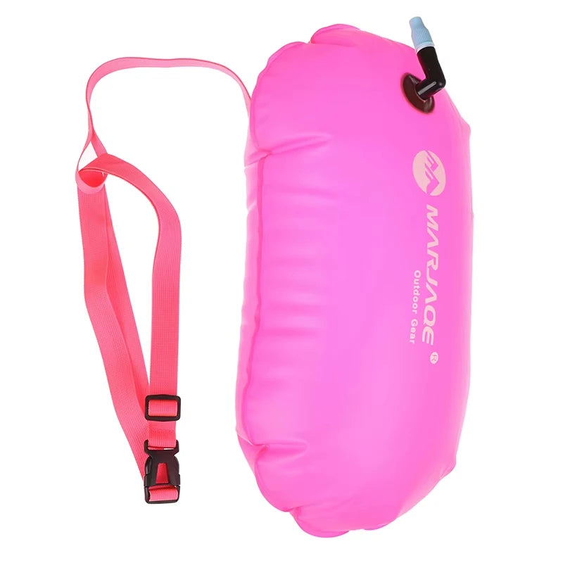 Inflatable swim buoy tow float in pink with crossbody strap and air valve