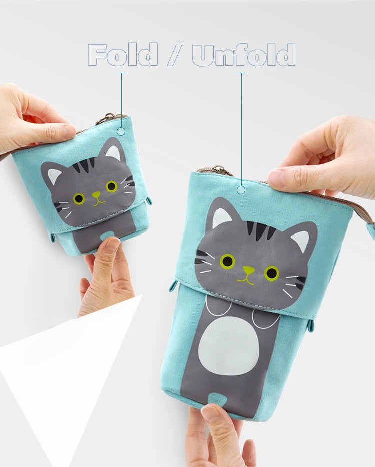Light blue cat face zip pencil pouch held in hands, showing foldable design