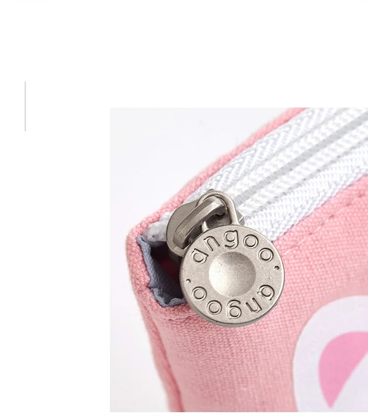 Pink pencil pouch with metal zipper pull and stitched fabric edge