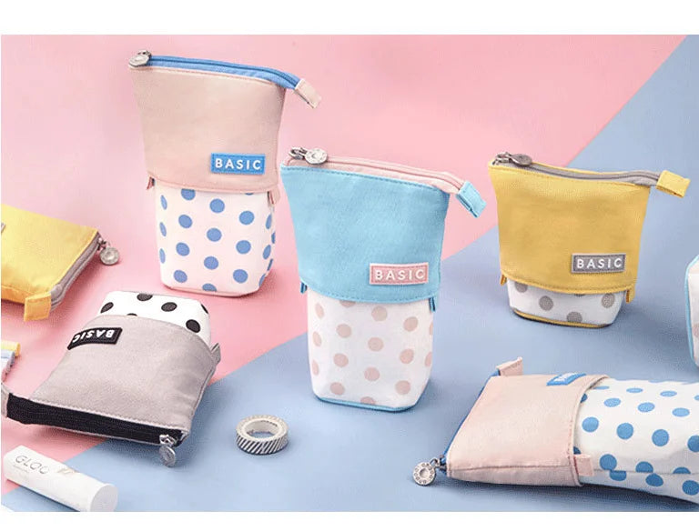 Set of small zipper pencil pouches in pastel colors with polka-dot designs