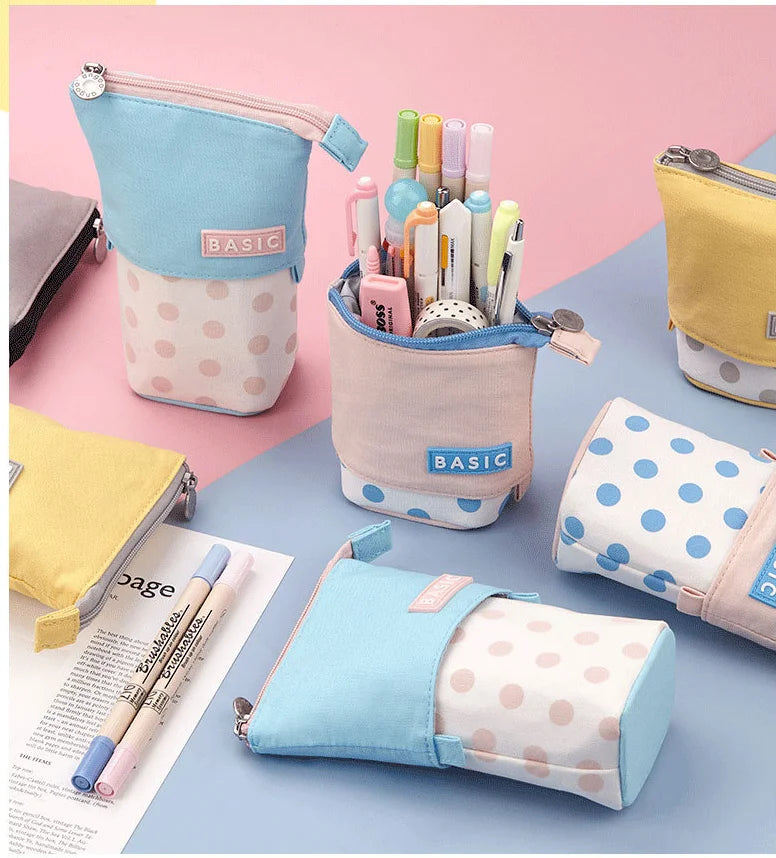 Group of pastel zipper pencil pouches with “BASIC” patches and dot patterns