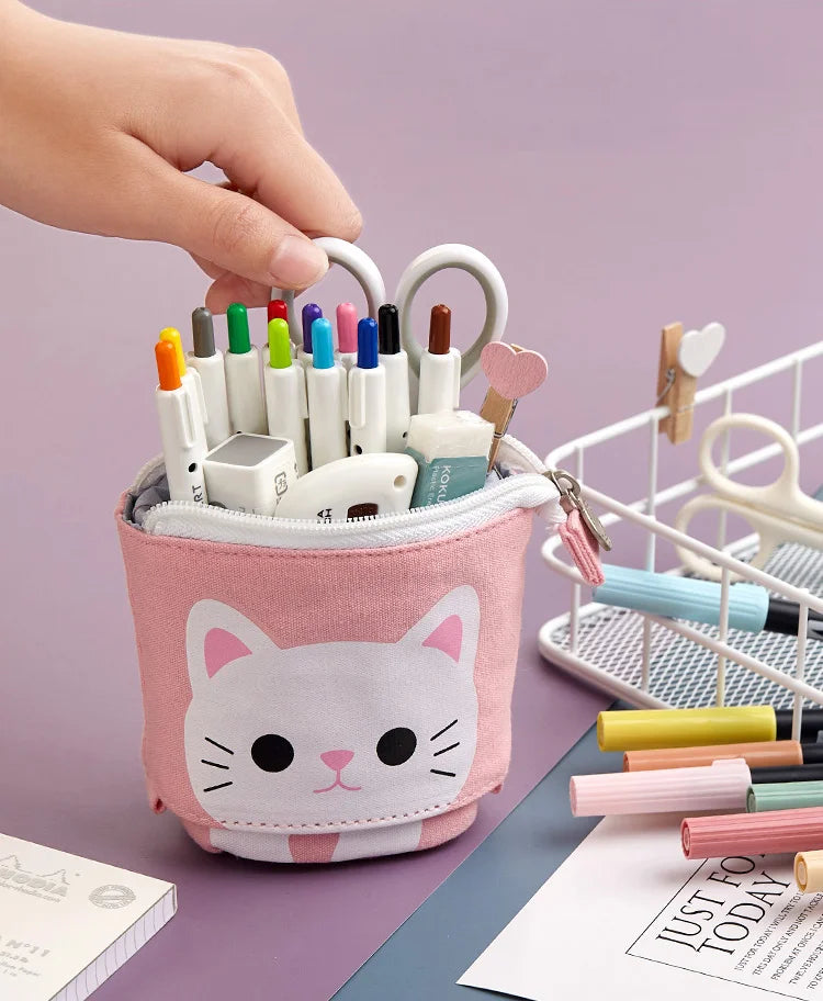 Pink cat pencil pouch with zipper, holding colored pens and markers