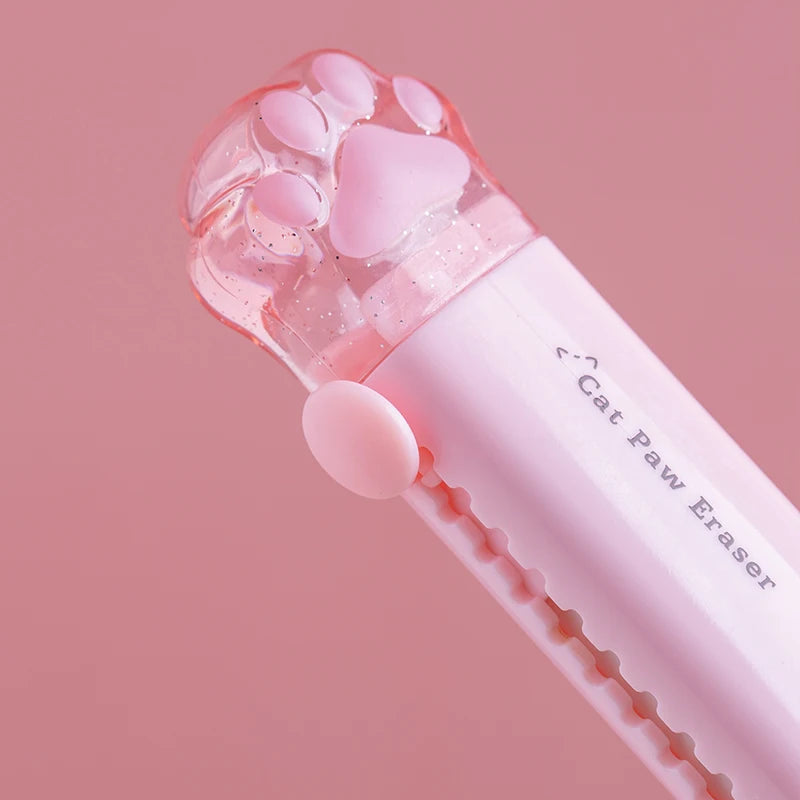 Pink cat paw retractable pencil eraser shown up close, claws detail on cap