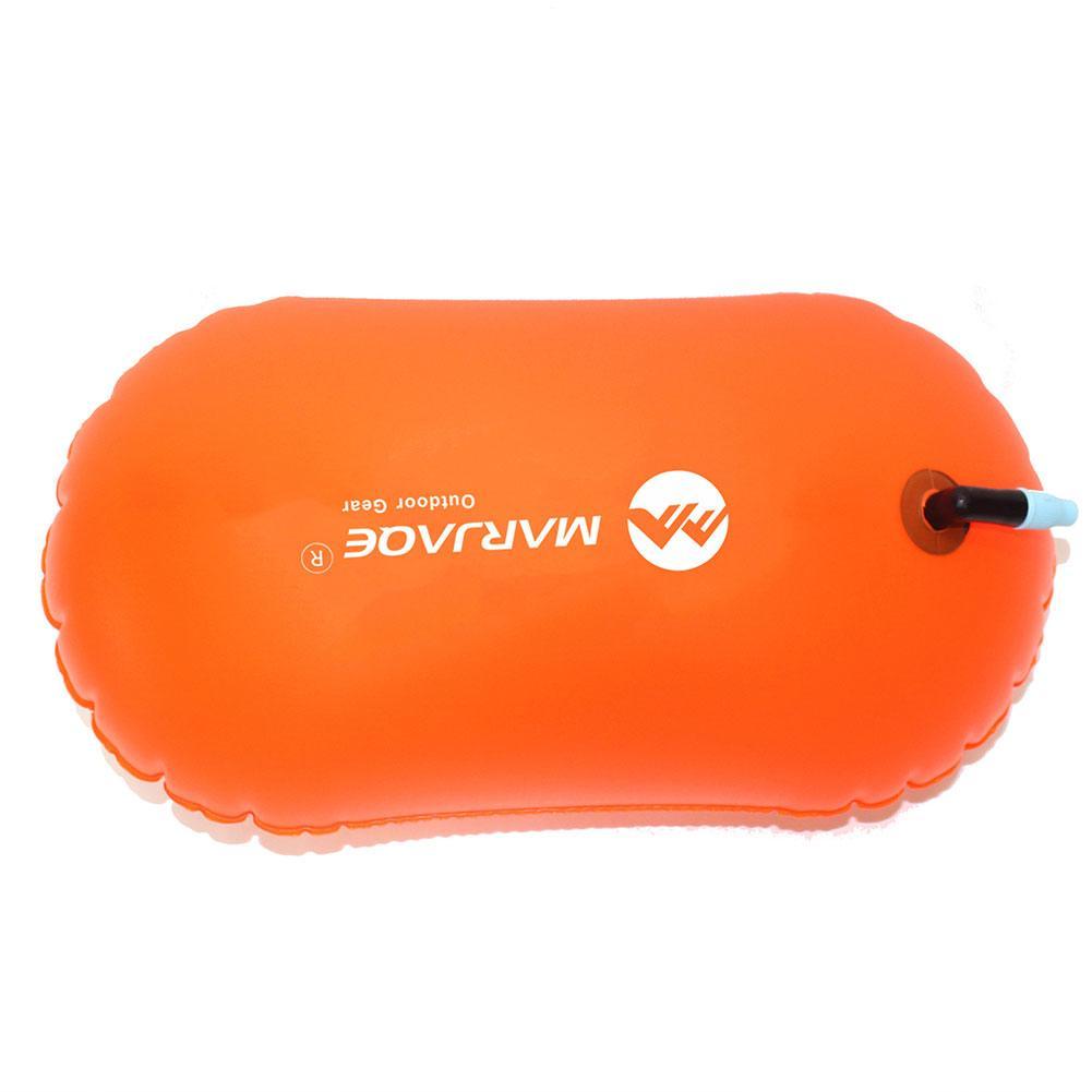 Inflatable swim buoy tow float in orange, side view with air valve