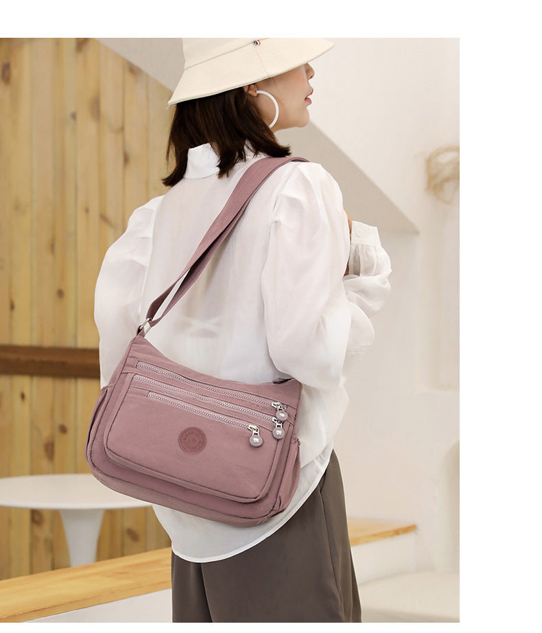 Nylon multi-layer crossbody shoulder bag, dusty pink, adjustable crossbody strap, pockets