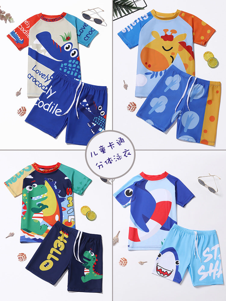 Kids' swimwear set with blue dinosaur cartoon rash shirt and navy shorts
