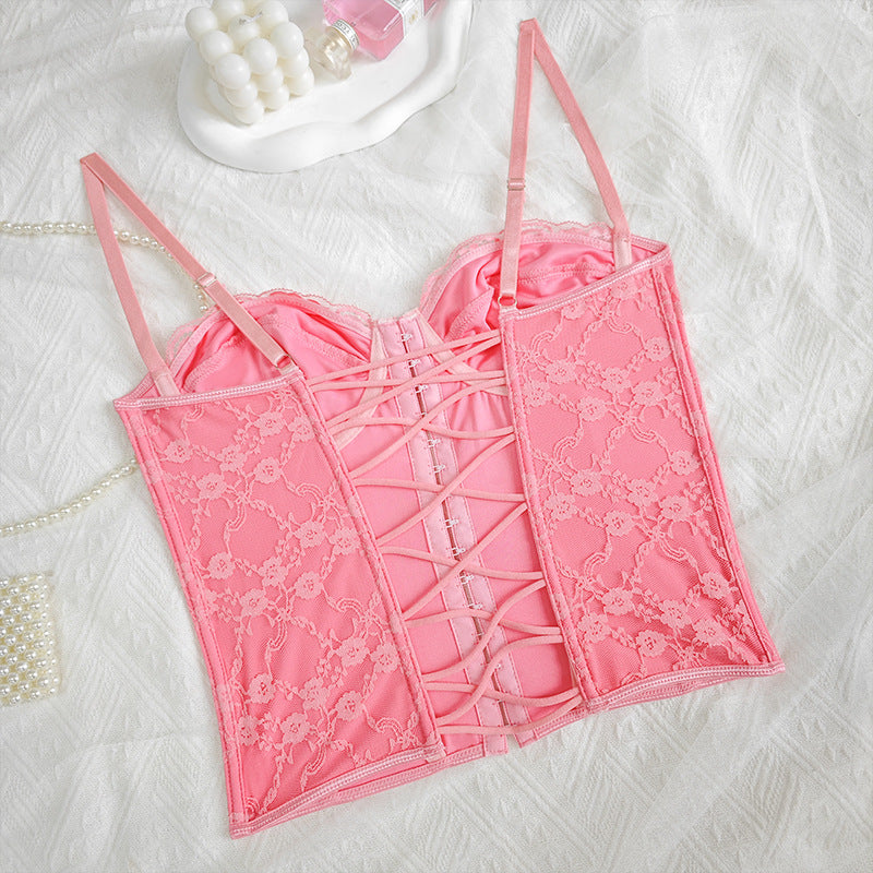 Pink lace corset top with front lace-up panels and thin shoulder straps