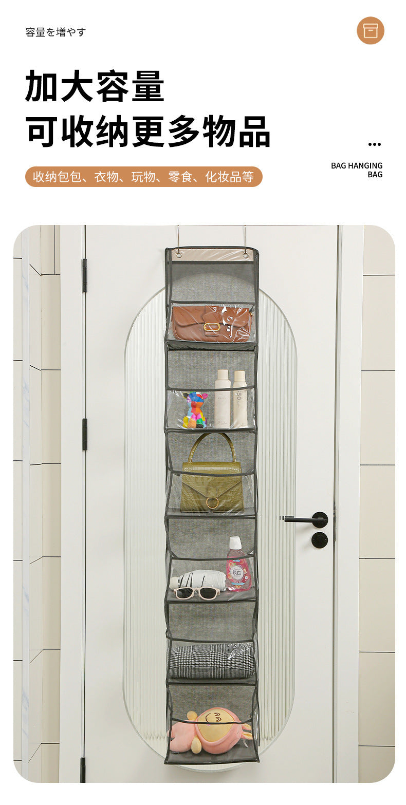 Gray over-door hanging storage bag with multiple pockets holding small household items