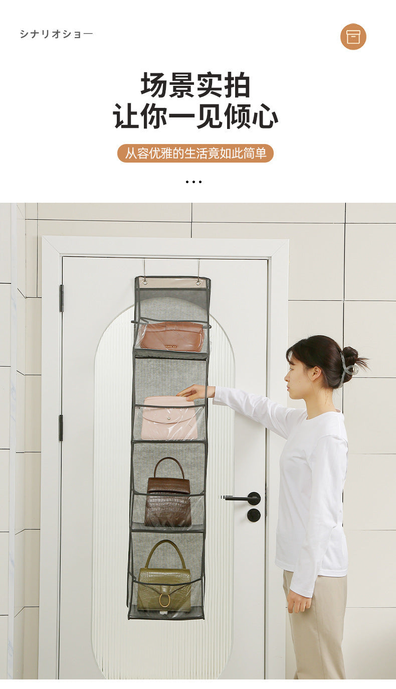 Gray over-door hanging storage bag with multiple pockets being used by a person