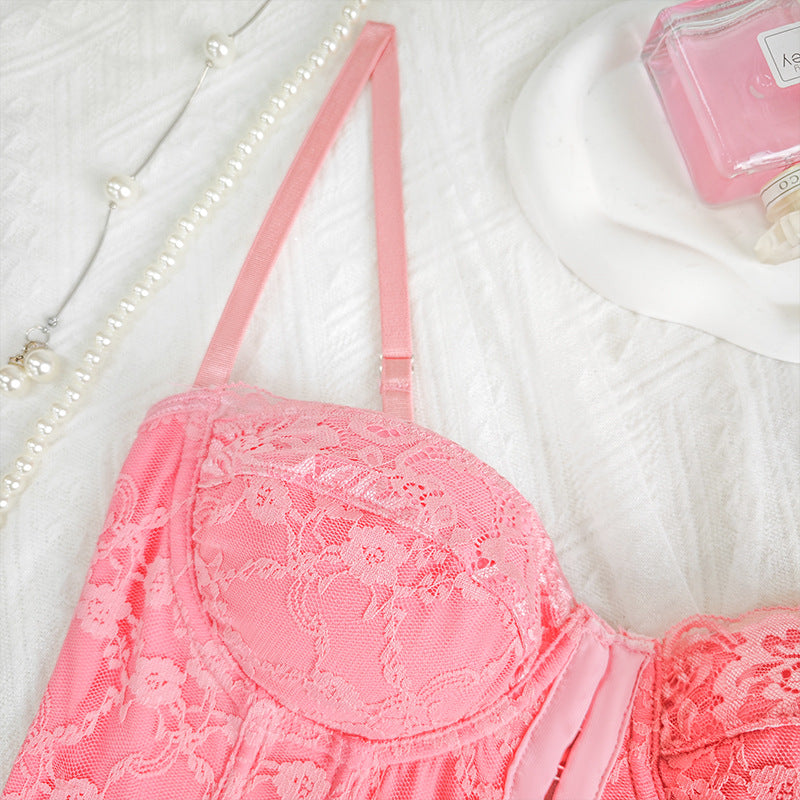 Pink lace corset vest close-up with underwire cup and embroidered floral texture