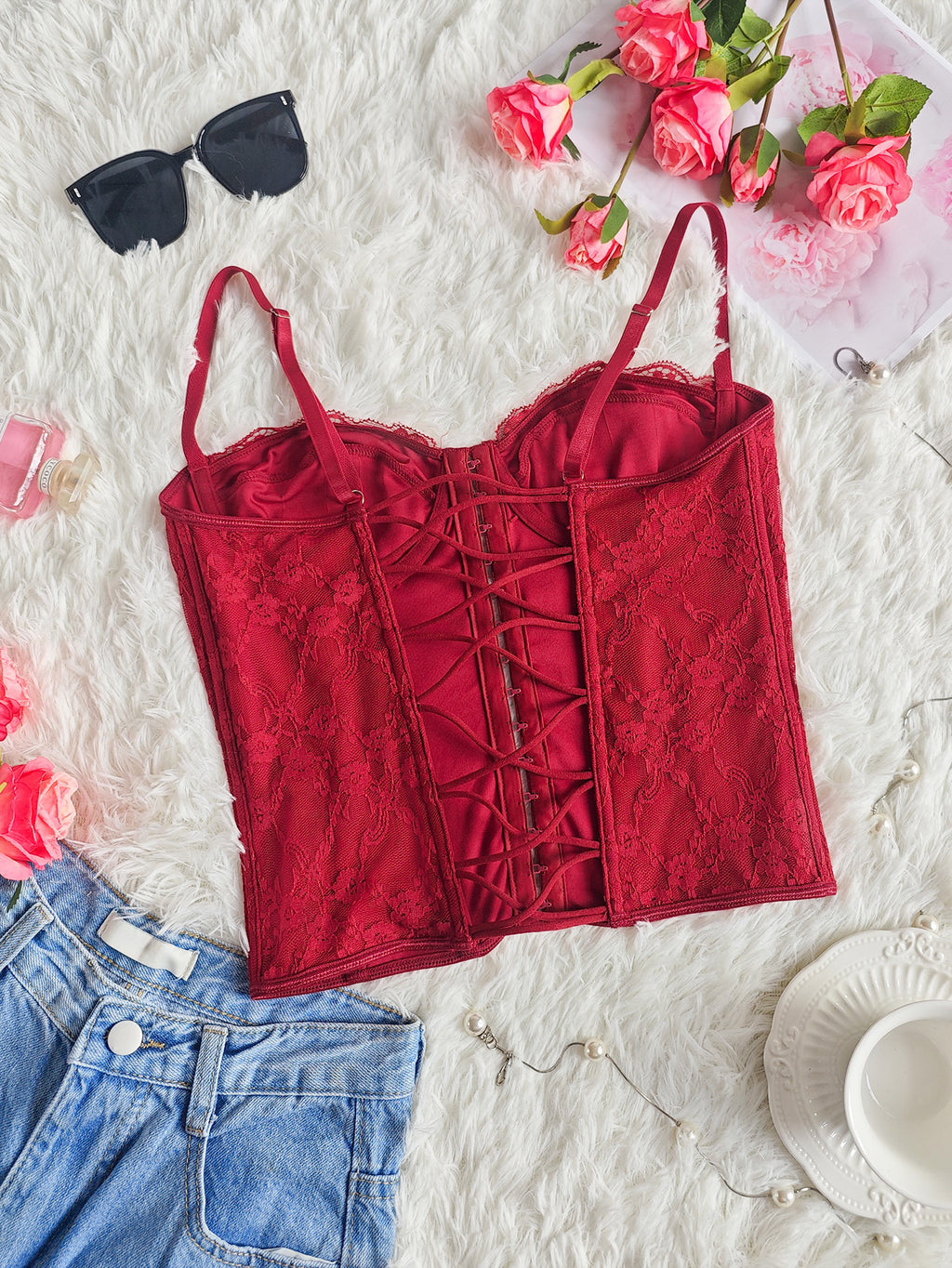 Burgundy lace corset bustier with front lace-up detailing and spaghetti straps