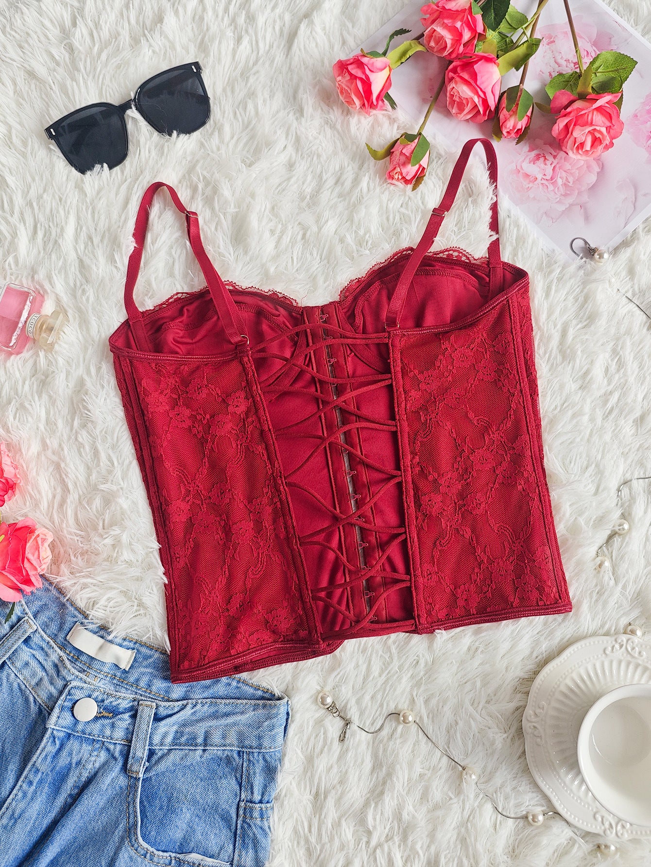 Burgundy lace corset bustier with front lace-up detailing and spaghetti straps
