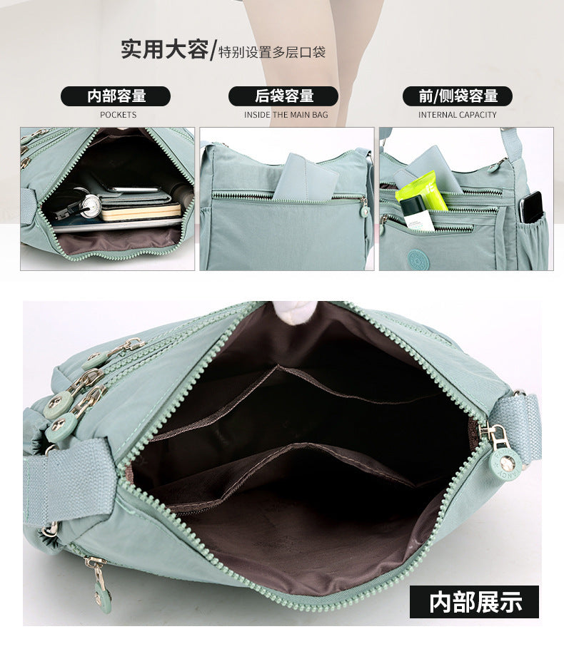 Water-blue multi-layer shoulder bag open view showing inner pockets and zippered lining.
