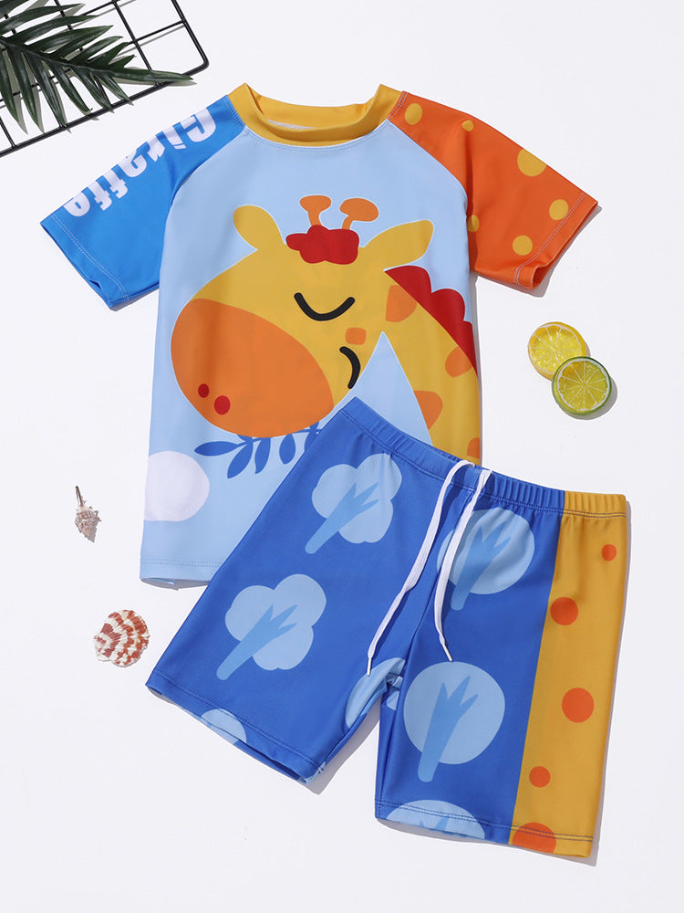 Kids' swimwear set with orange giraffe cartoon rash shirt and blue graphic shorts