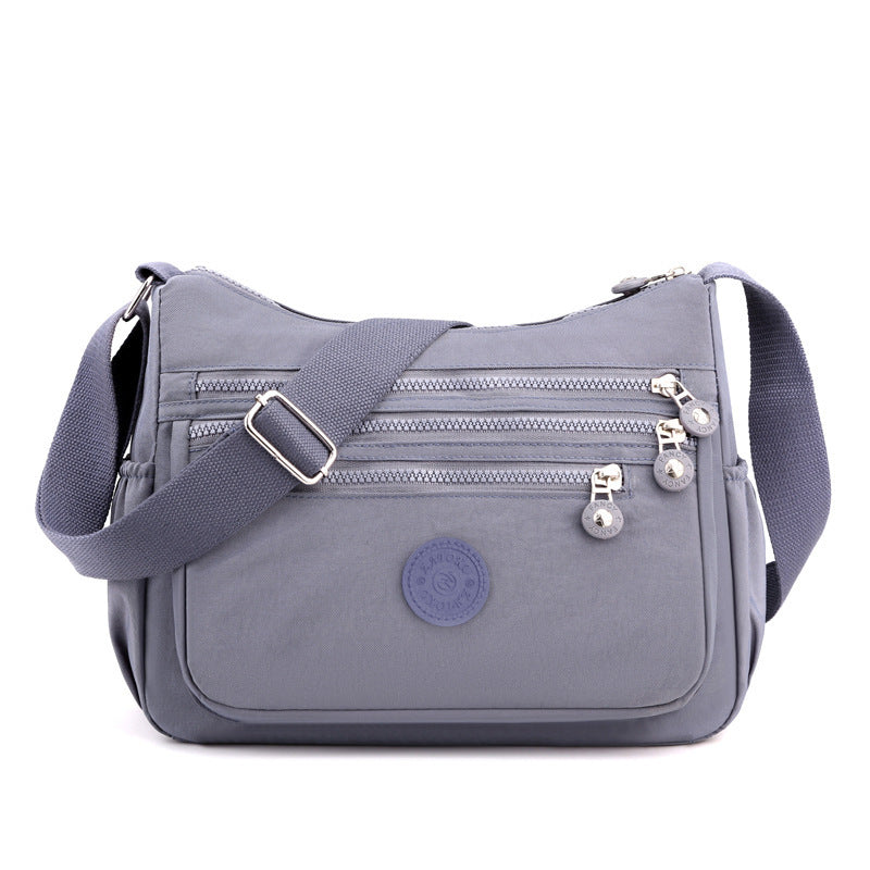 Lightweight nylon crossbody shoulder bag, gray with multiple front zipper pockets
