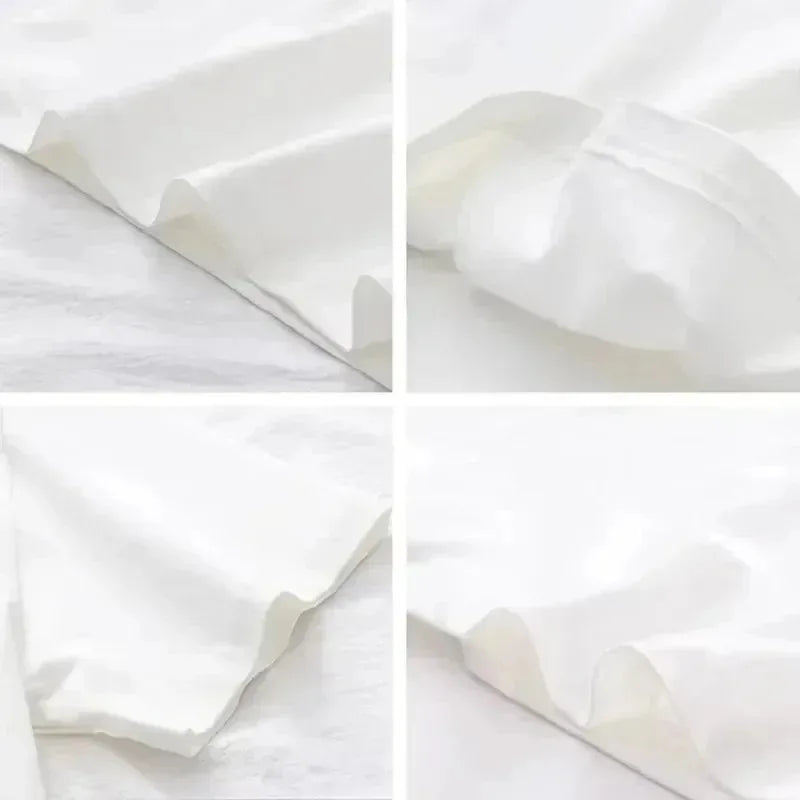 White T-shirt fabric close-up with soft folds and wrinkles