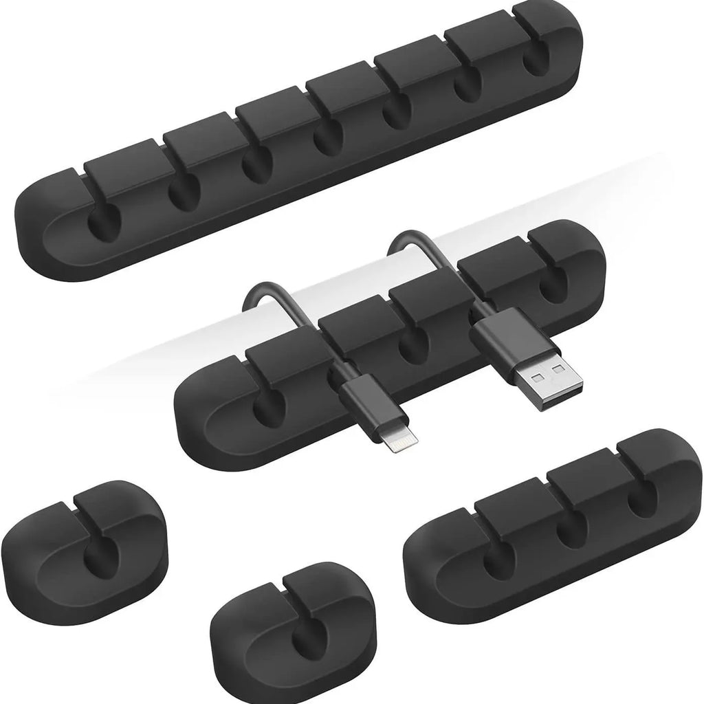 Black cable organizer snap clips holding charging cables with USB ends