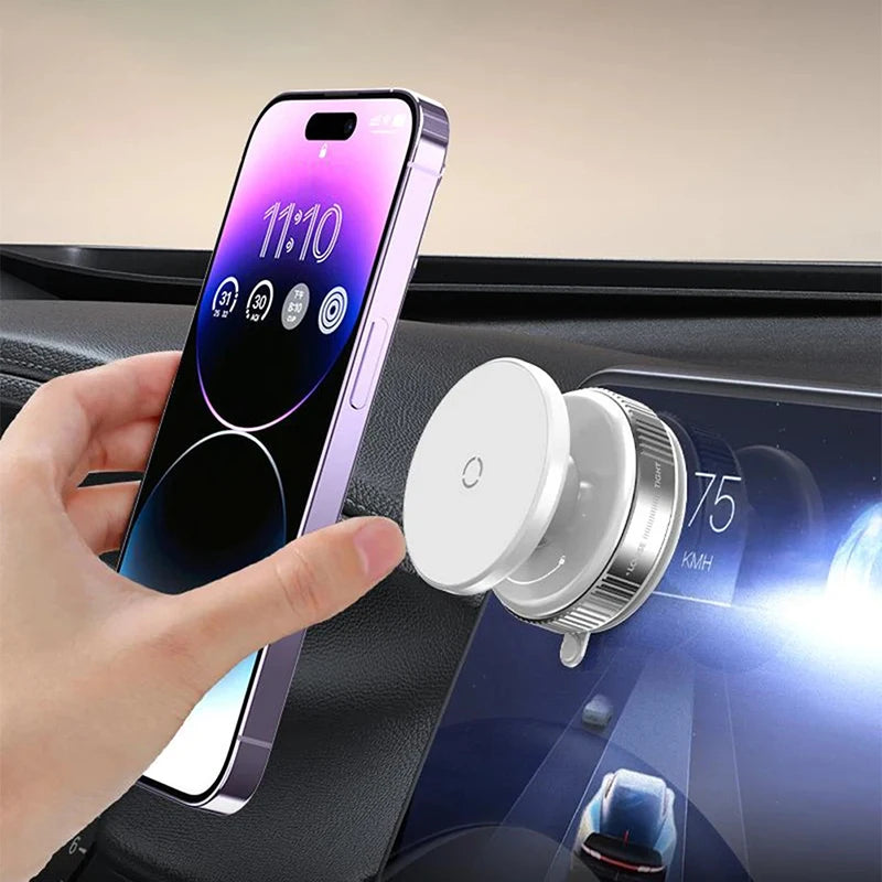 White magnetic phone holder securing a phone to the dashboard-mounted ring