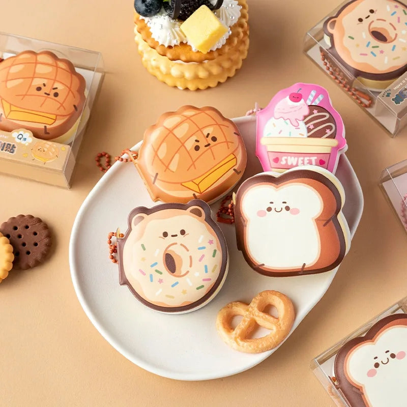 Assorted cartoon dessert and animal soft memo pads arranged on a round tray