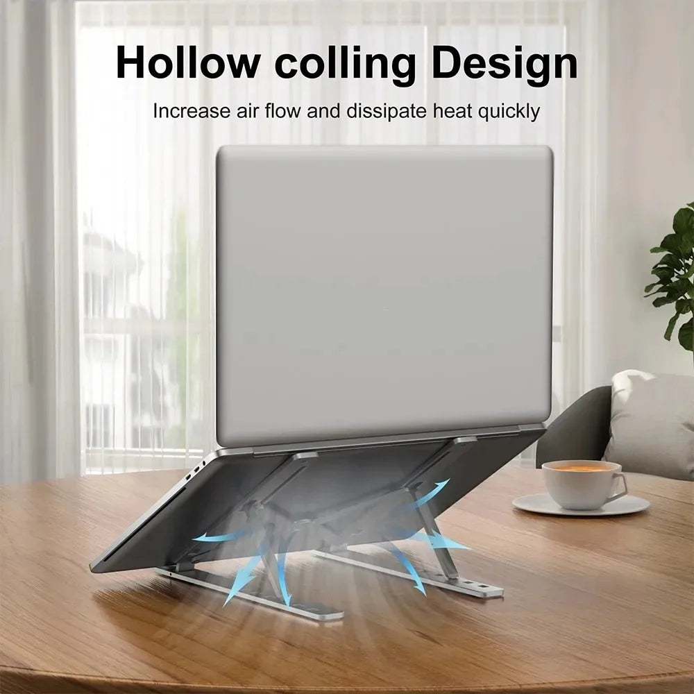 Hollow-cooling foldable laptop stand with gray top and metal legs, airflow vents.