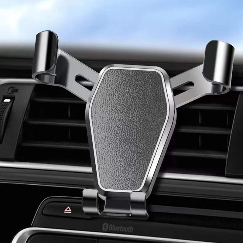 Car phone holder with spring arms gripping air vents and textured center back plate