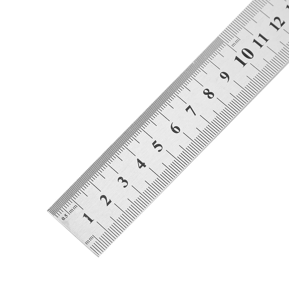 Close-up of stainless steel ruler corner showing etched numbers and tick marks