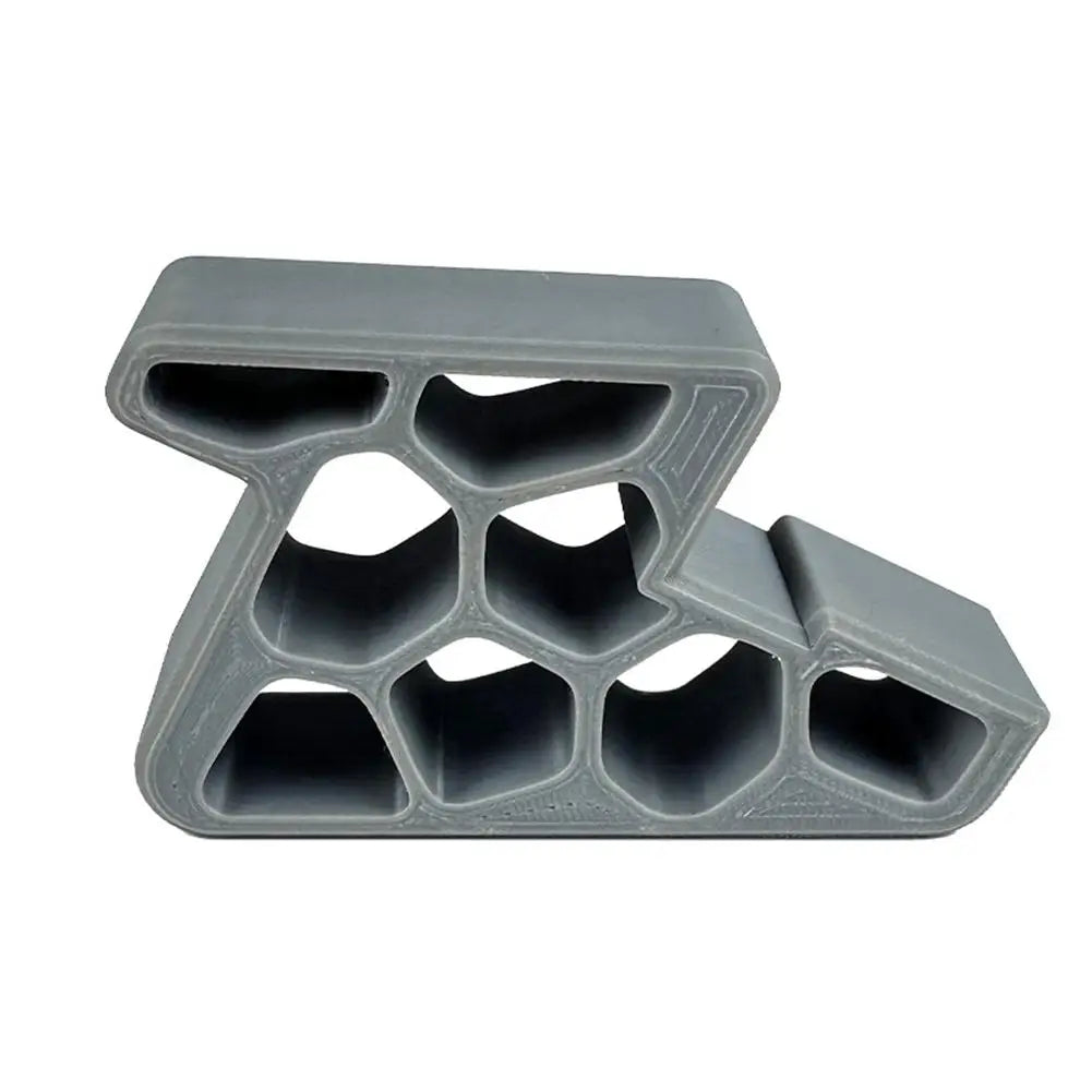 Light gray door stop wedge with track lock and anti-slip honeycomb pattern