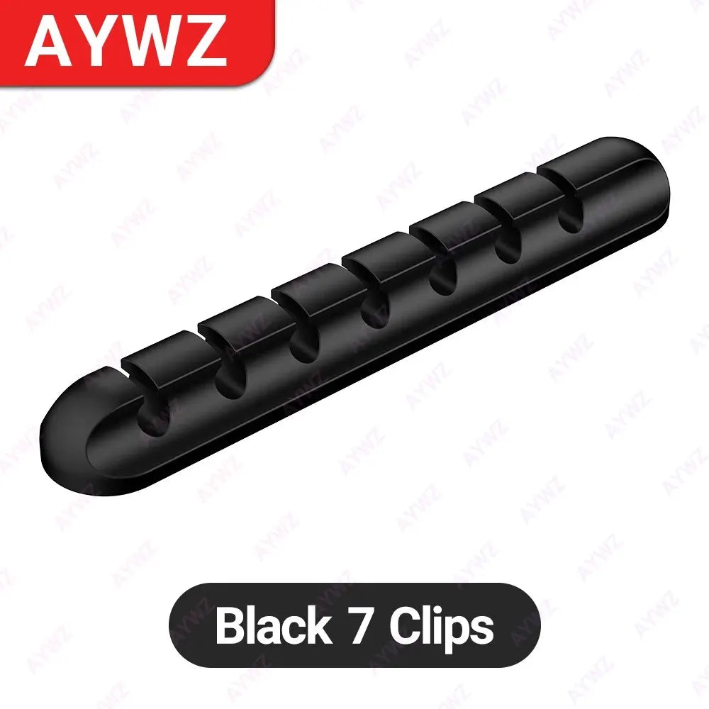 Black adhesive cable holder clip bar with seven round openings for USB charging cords