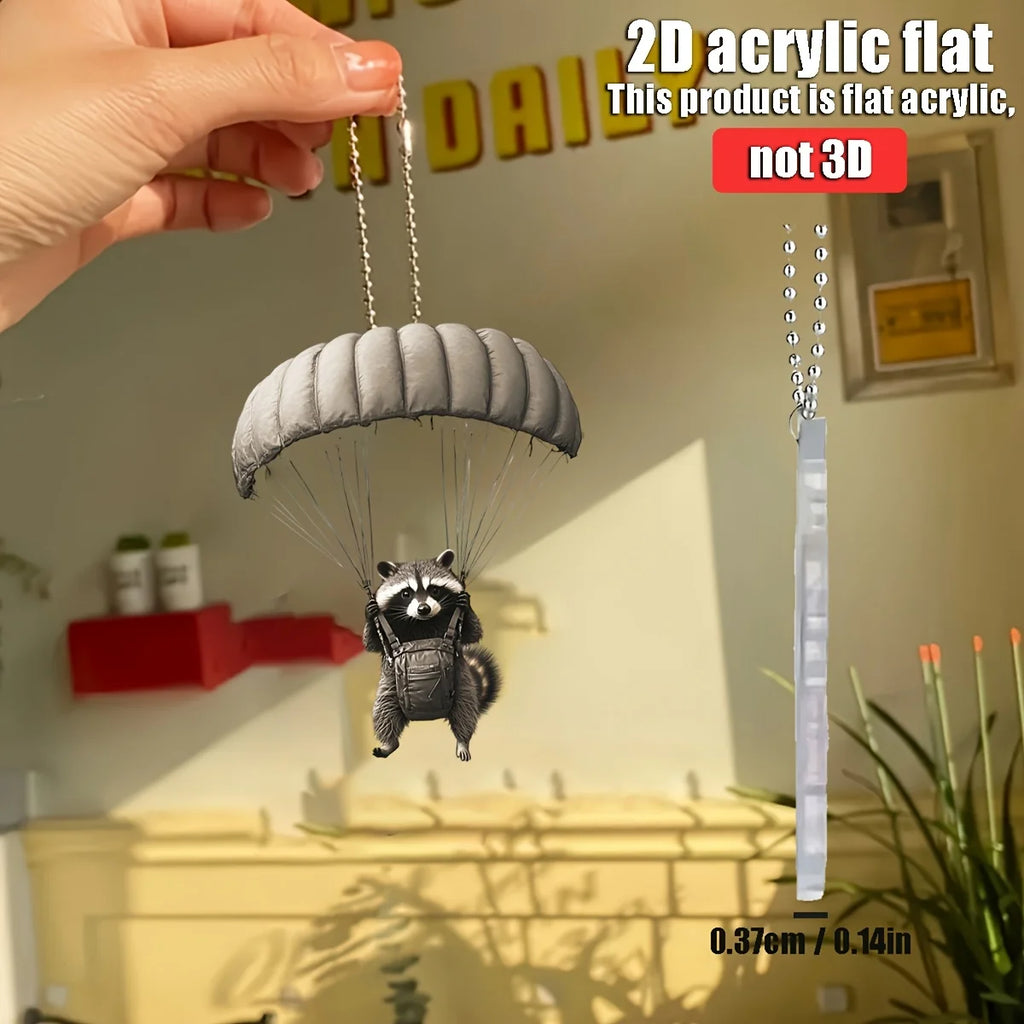 Parachute animal pendant keychain held by hand, off-white parachute and beaded chain