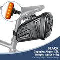 Waterproof black bicycle saddle tool bag with textured fabric, zipper, and reflective side panel