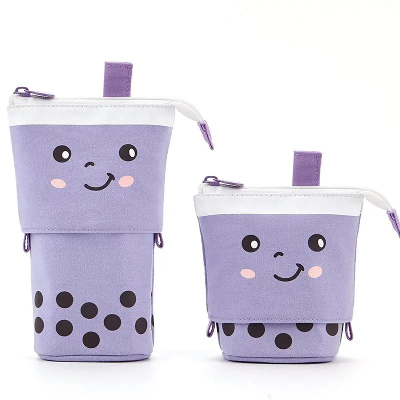 Canvas pencil pouch with zipper, lavender cat face with black polka-dot bottom.