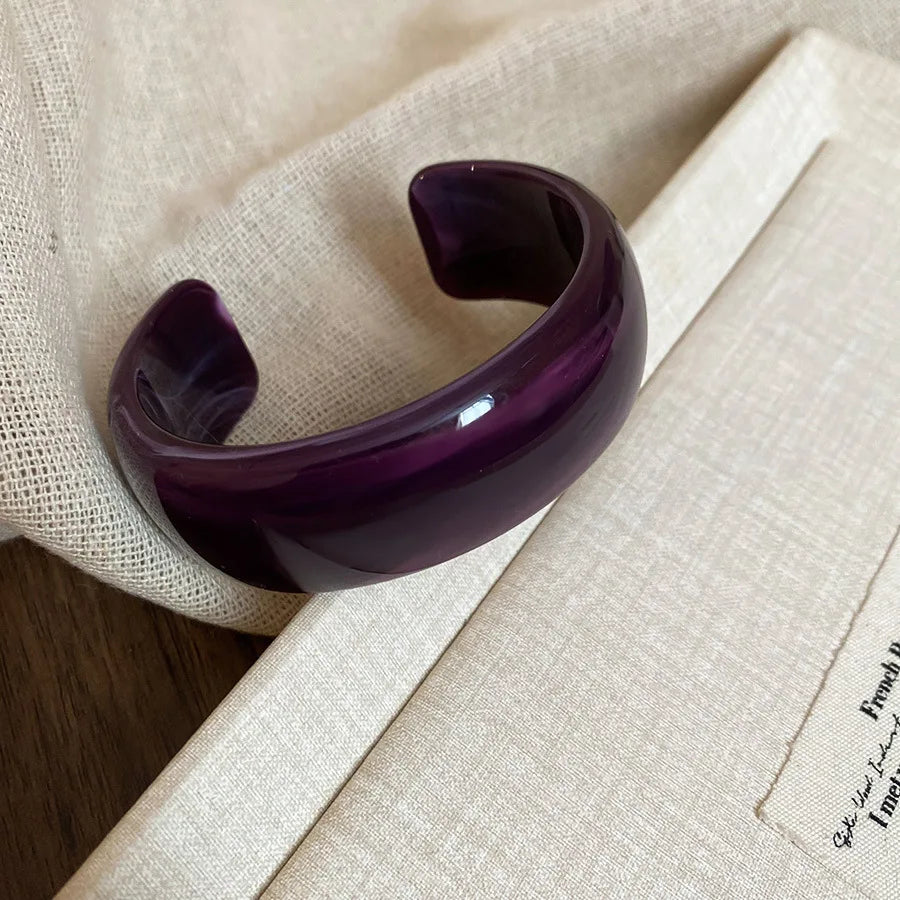 Deep purple translucent acrylic open bangle with shiny rounded face smudge design
