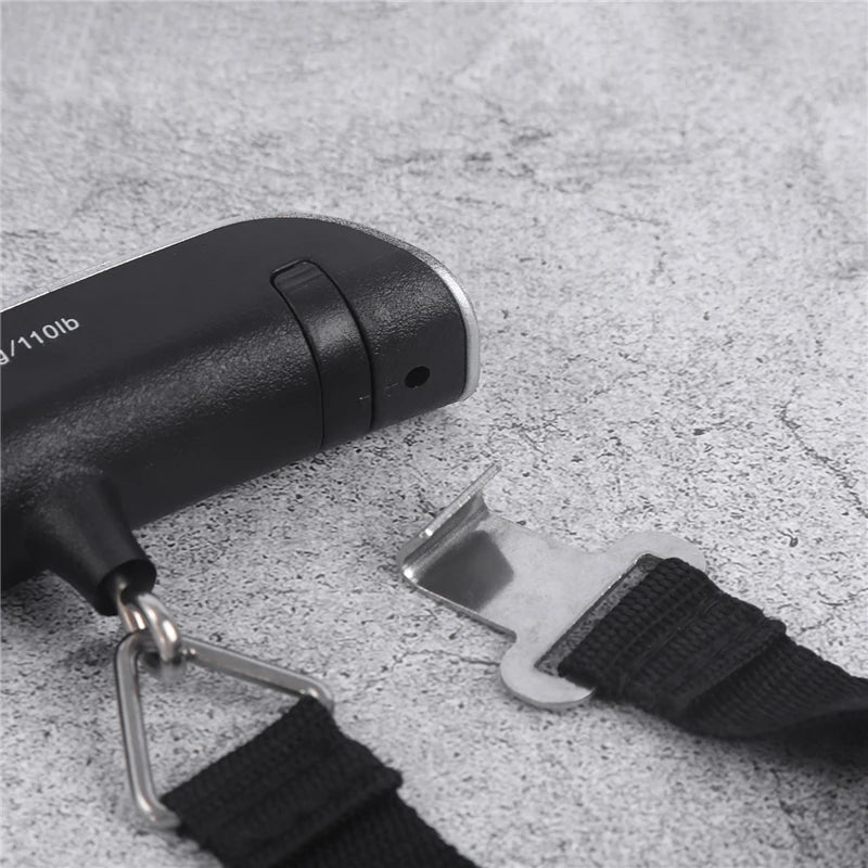 Portable digital luggage scale end view showing hook and strap attachment
