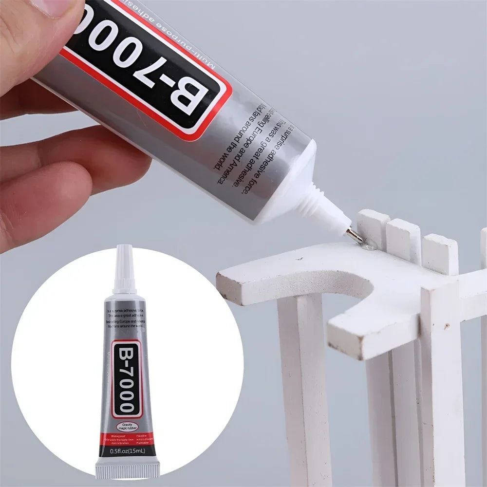 B-7000 clear adhesive tube in hand with white nozzle and dispensing tip