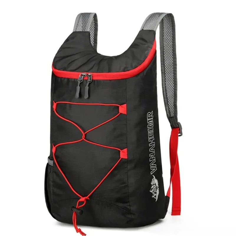 Black folding backpack with red trim, front bungee organizer and zip pocket
