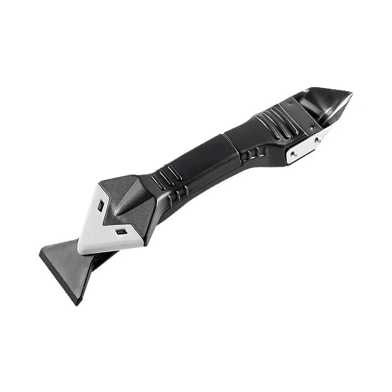 Compact silicone scraper tool with angled metal blade and black grip for seam work