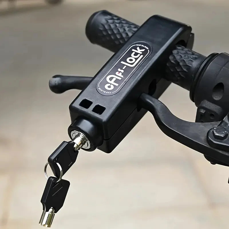 Black handlebar grip lock clamped on bicycle grips with keys attached