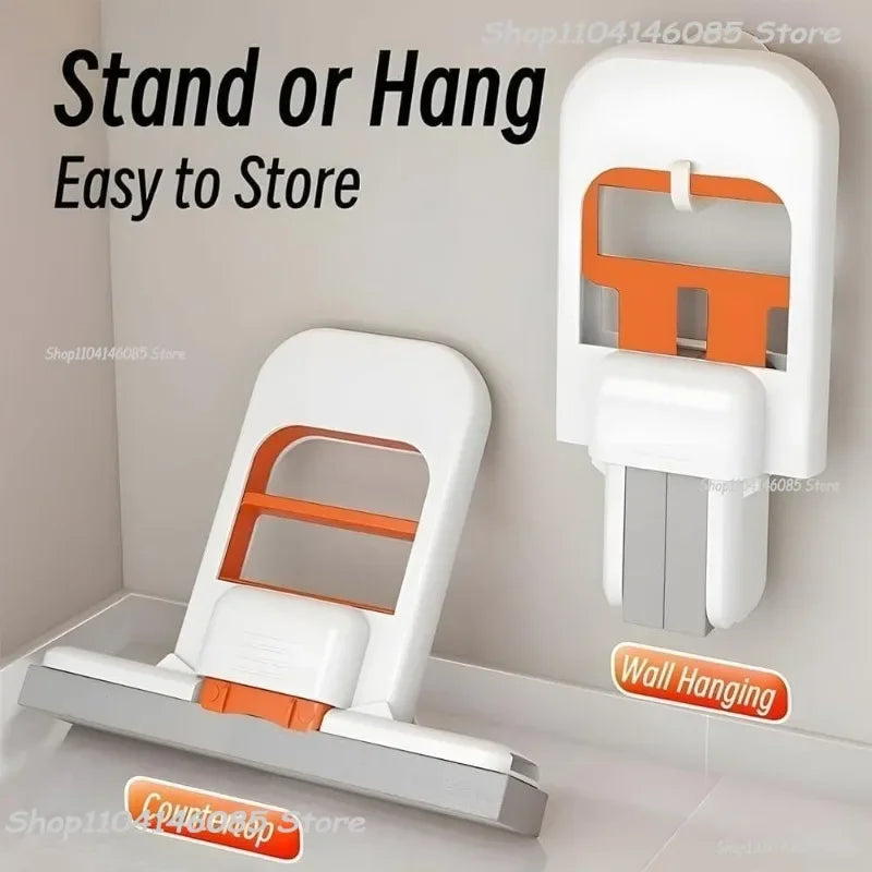 Foldable mini desktop mop in white with orange insert, shown standing and wall-hanging position