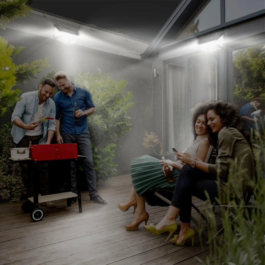 Outdoor solar LED motion sensor light illuminating porch walkway, black fixture