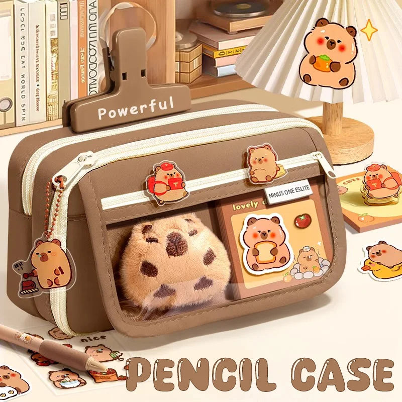 Brown capybara pencil case with flip-top cover, zipper compartments and sticker pockets