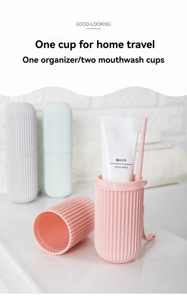 Pink ribbed travel toothbrush holder cup with toothbrush inside