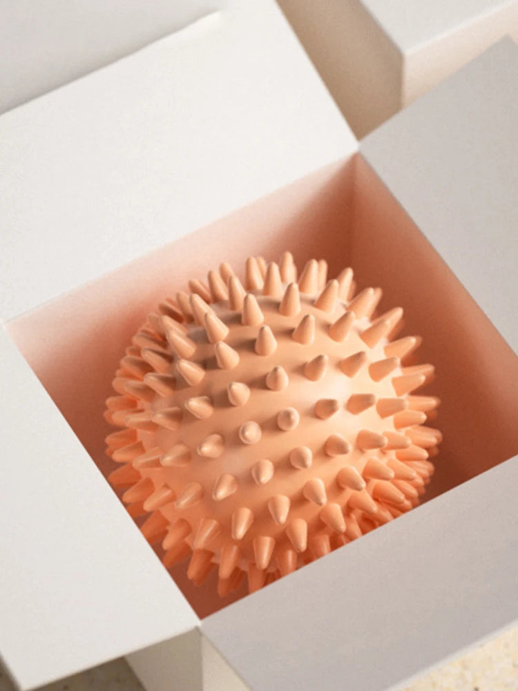 Orange spiky massage ball in a box