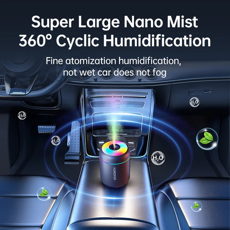 Black mini car humidifier with rainbow LED top and visible mist plume
