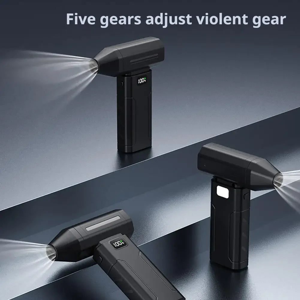 Black handheld fan blower producing airflow with adjustable speed display