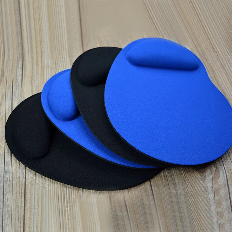Blue and black mouse pads with wrist rests, showing raised center pads