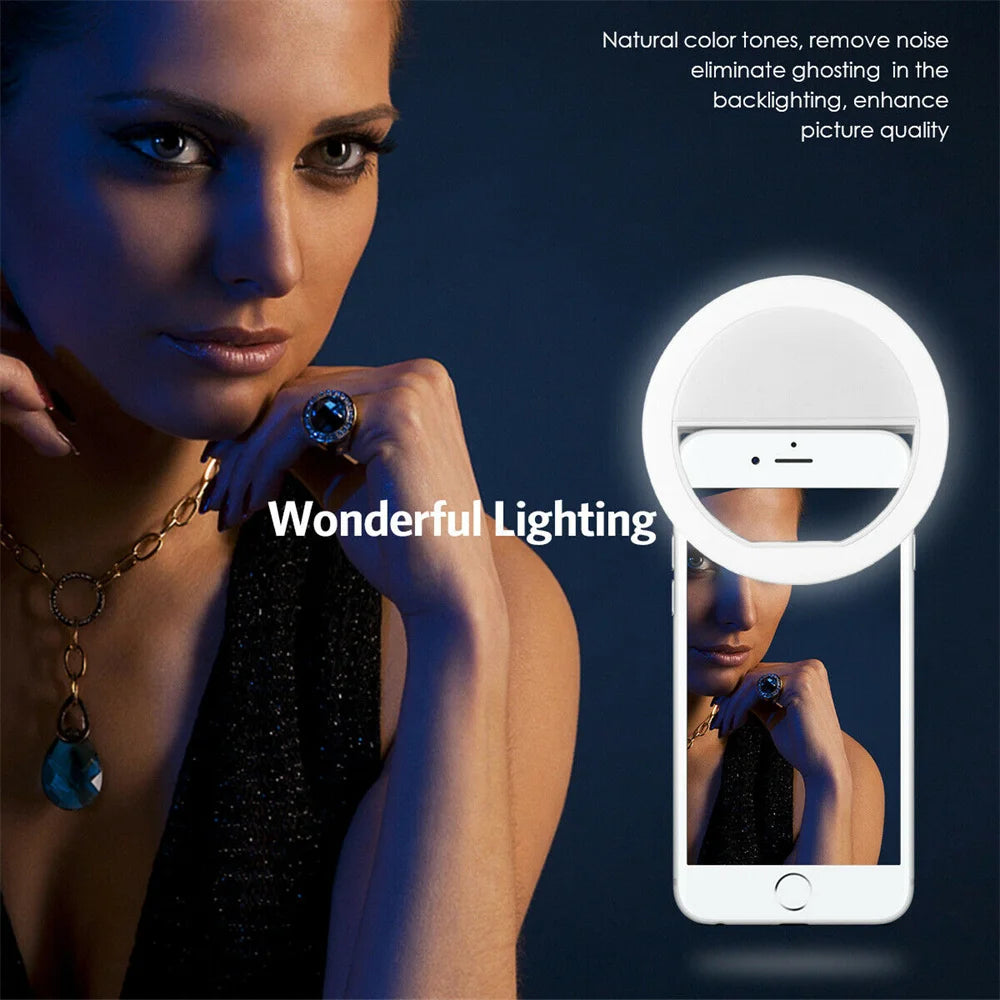 White circular LED selfie ring light illuminating a smartphone screen portrait
