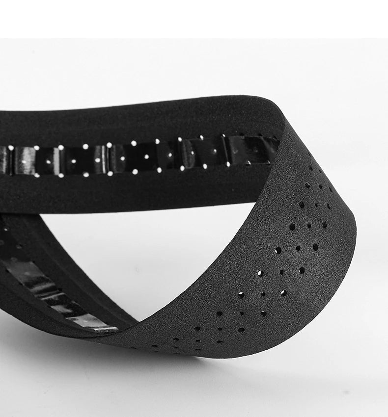 Black handlebar tape wrapped edge with textured grip and perforation holes
