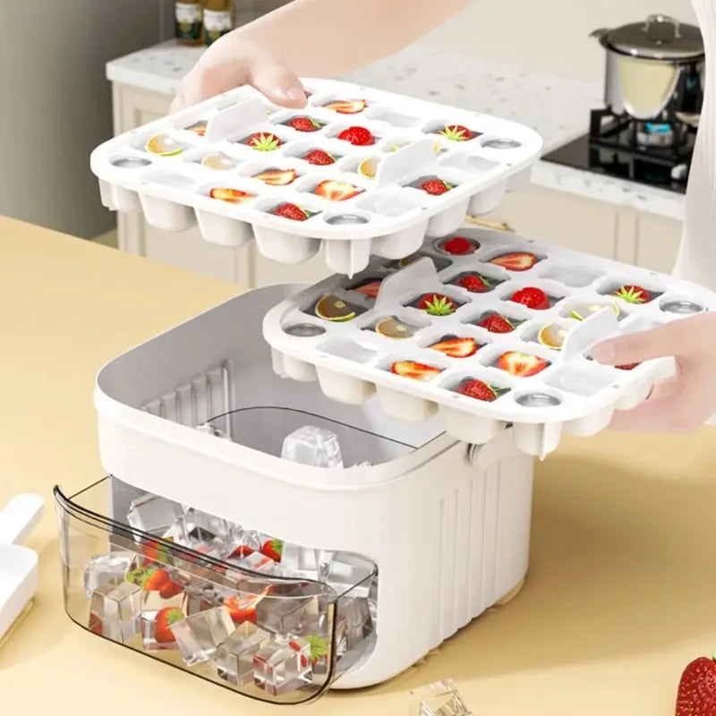 White ice cube machine holding cube molds, with tray releasing ice blocks.