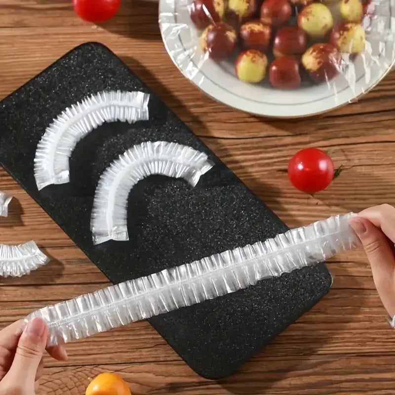 Disposable clear food cover plastic wrap strips, ready to wrap food on boards